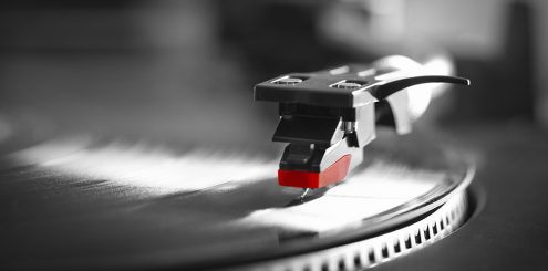 Record turntable playing vinyl record