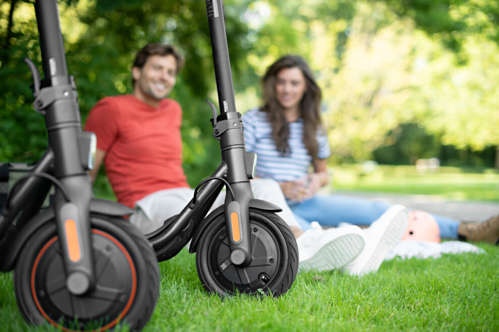 Ninebot KickScooter F20 F30 F40 Lifestyle picture Woman and Man sitting looking at front tyres