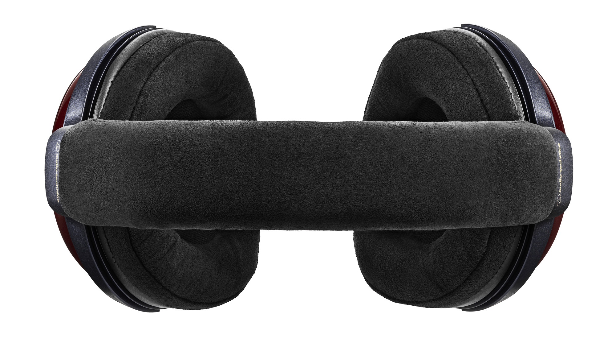 Audio-Technica lover åpen drømmelyd fra de lukkede ATH-AWX7000 4 Audio-Technica ATH-AWX7000 sett ovenfra, med polstret hodebøyle og store, sorte øreputer.